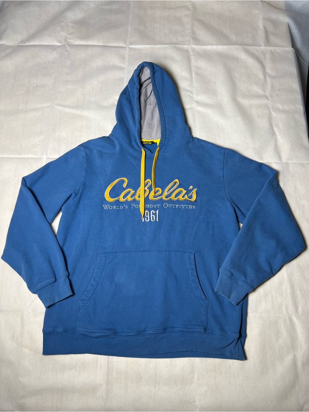 Cabela's‎ blue hoodie with yellow drawstrings